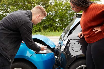 two-angry-motorists-arguing-over-car-accident-UELZWFR