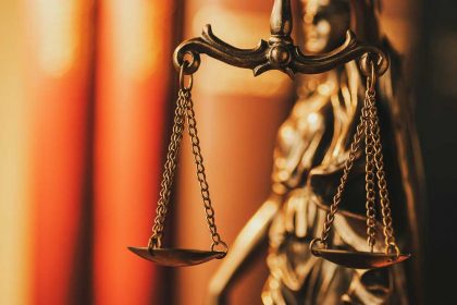 scales-of-justice-in-a-close-up-view-MN6ZJSB