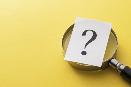 printed-question-mark-covering-a-magnifying-glass-2021-04-02-23-57-12-utc