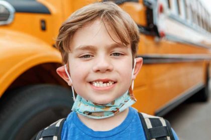 boy-kid-student-take-off-protective-face-mask-and–J2NRUUG